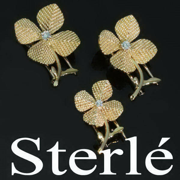 Set of three French gold lapel pins signed Sterle